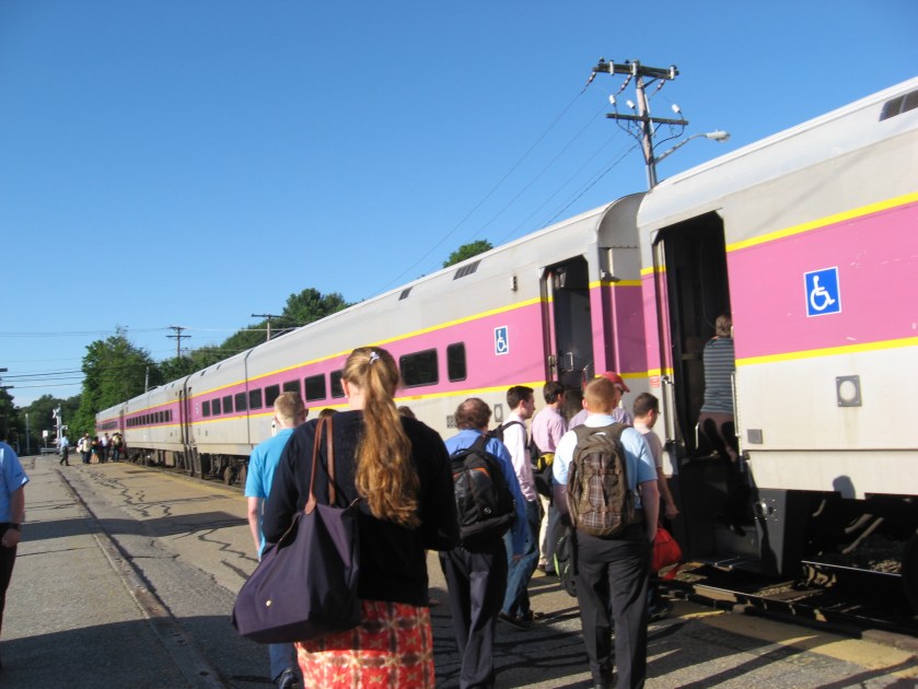 People boarding a commuter train