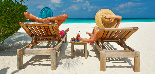 couple-beach-loungers