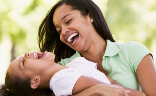 hugging and laughing