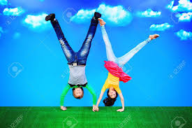 boy and girl doing handstands